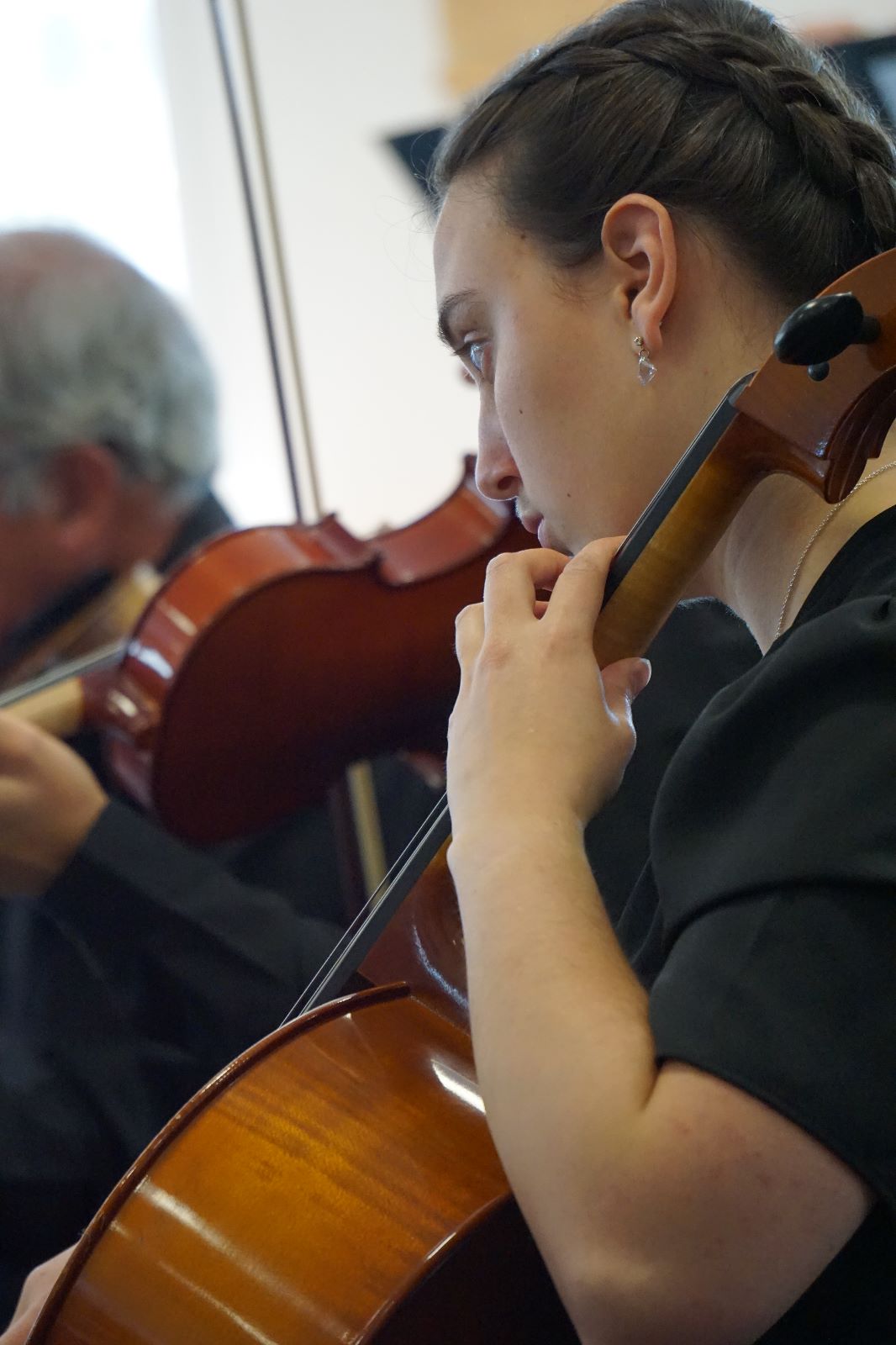 Image of cello players during one of our concert